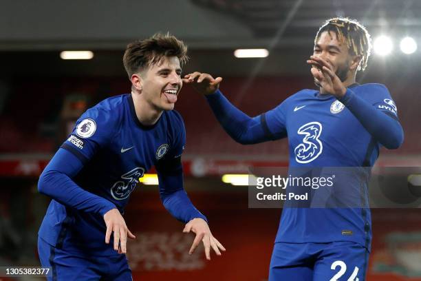 Mason Mount of Chelsea celebrates with teammate Reece James after scoring his team's first goal during the Premier League match between Liverpool and...