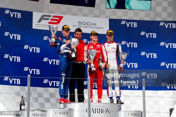 Champion Robert Shwartzman PREMA Racing, celebrates on the podium with team boss Rene Rosin, race winner Marcus Armstrong PREMA Racing and Niko Kari...