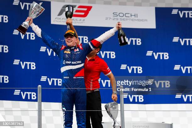 Champion Robert Shwartzman PREMA Racing, celebrates on the podium with team boss Rene Rosin during the Sochi at Sochi Autodrom on September 28, 2019...