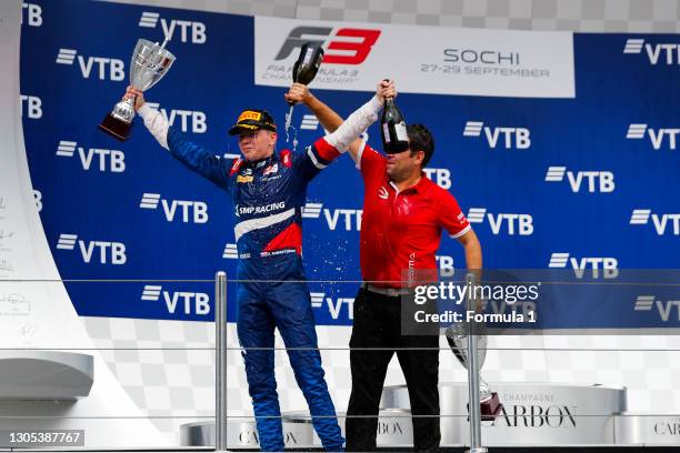 Champion Robert Shwartzman PREMA Racing, celebrates on the podium with team boss Rene Rosin during the Sochi at Sochi Autodrom on September 28, 2019...