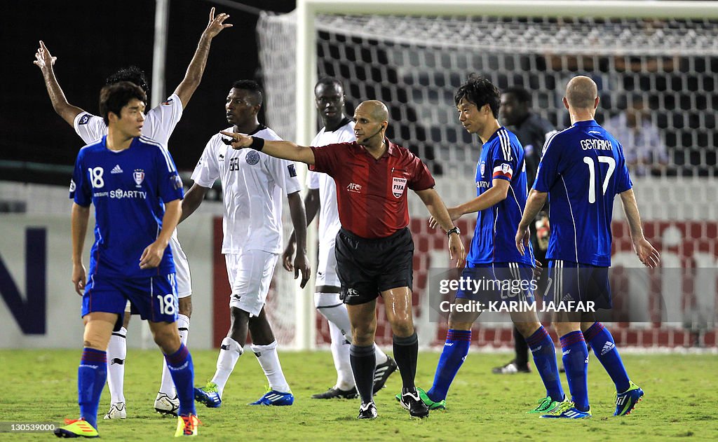 UAE referee  Ali Hamad gestures towards