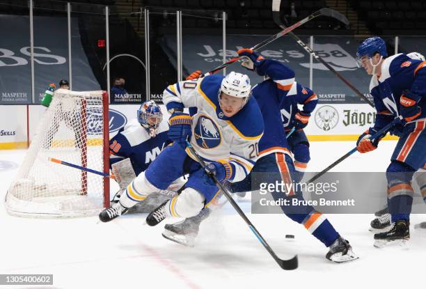 Andy Greene of the New York Islanders defends against Cody Eakin of the Buffalo Sabres during the first period at the Nassau Coliseum on March 04,...