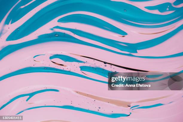 cosmetic background made of natural moisturizing gel in wave shape on bright pink blue background. flat lay style. concept of trendy body care procedures of the year - aqua fitness stock pictures, royalty-free photos & images