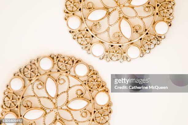 abstract image of vintage jewelry - gold hoop earring stock pictures, royalty-free photos & images