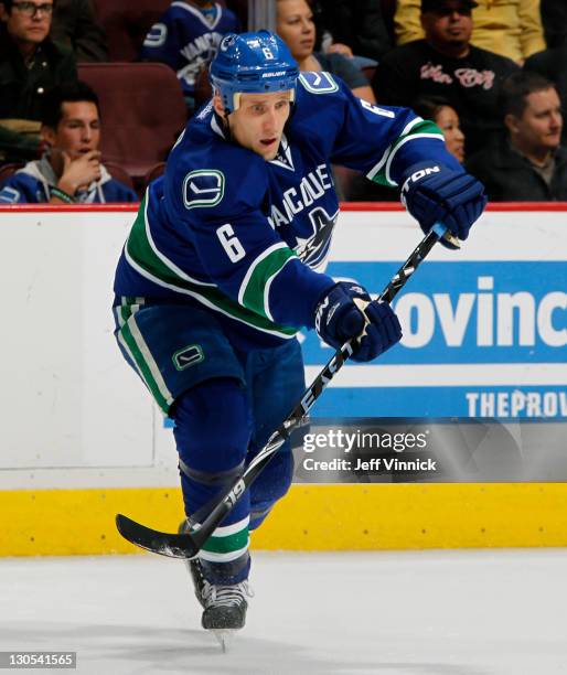 Sami Salo of the Vancouver Canucks passes the puck up ice during their NHL game against the Nashville Predators at Rogers Arena October 20, 2011 in...