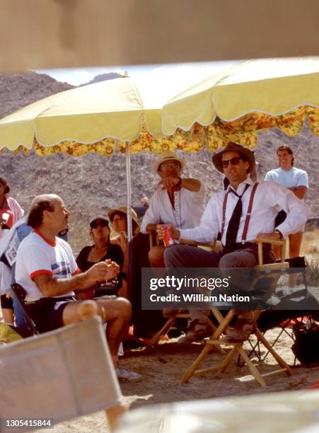 German filmmaker and director Volker Schlöndorff and American actor, playwright, author, screenwriter, and director Sam Shepard sit on the set of the...