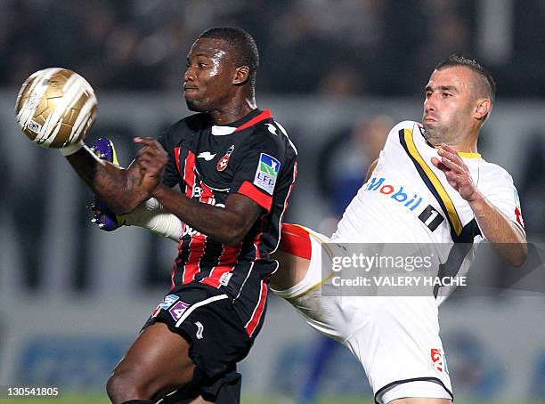 Nice's forward Franck Dja Djedje vies with Sochaux's defender David Sauget during the French League Cup football match Nice vs Sochaux, on October...