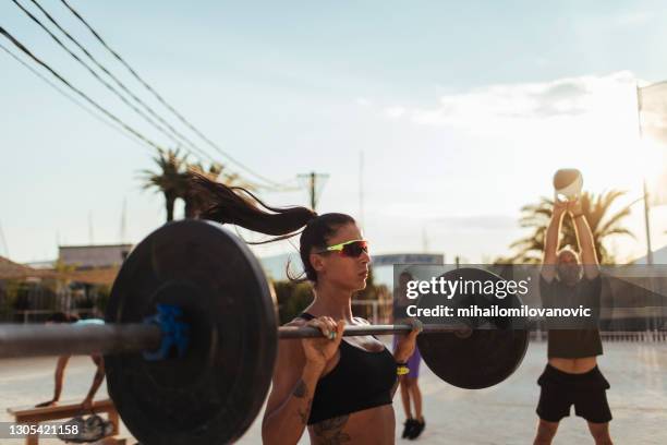 rocking that weight bar - barbell stock pictures, royalty-free photos & images