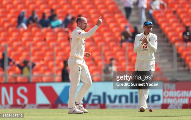 Jack Leach of England celebrates after taking the wicket of Cheteshwar Pujara of India watched on by Joe Root during Day Two of the 4th Test Match...