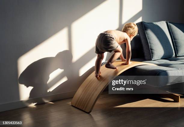 little boy climbing - baby climbing stock pictures, royalty-free photos & images
