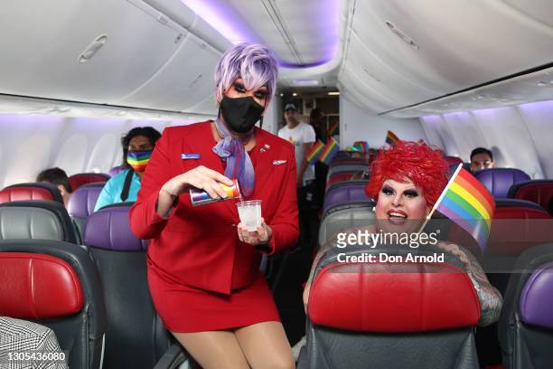 Penny Tration chats to Maxi Shield during Virgin Australia's special Pride Flight bound for Sydney on March 05, 2021 in Brisbane, Australia. The...