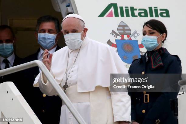 Pope Francis waves as he departs for his trip to Iraq from Leonardo Da Vinci airport on March 05, 2021 in Rome, Italy. Pope Francis will start the...