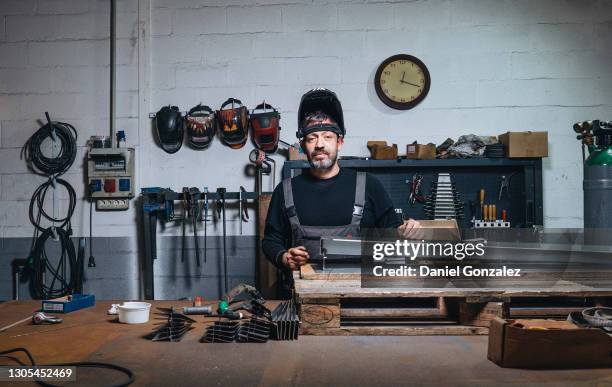 welder welding metal in a factory - in flames i the mask stock pictures, royalty-free photos & images