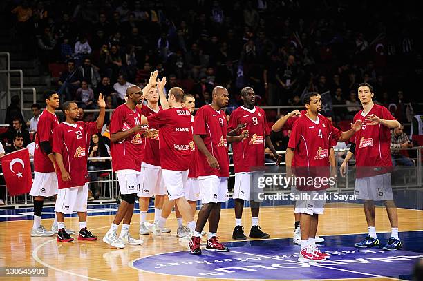 Players of Belgacom Spirou celebrate at the end of the 2011-2012 Turkish Airlines Euroleague Regular Season Game Day 2 between Anadolu Efes Istanbul...