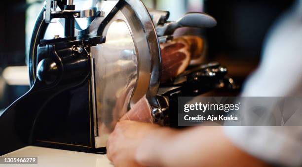 meat slicer with prosciutto. - chopped imagens e fotografias de stock