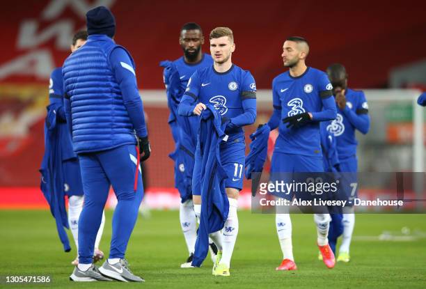 Timo Werner of Chelsea hands his tracksuit to a kit man prior to the Premier League match between Liverpool and Chelsea at Anfield on March 04, 2021...