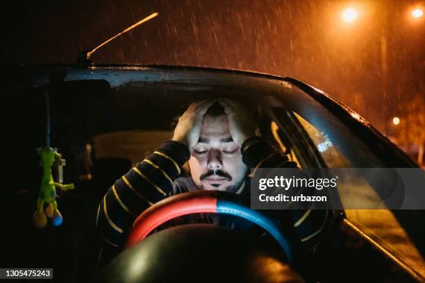 worried man sitting in car - tired driver stock pictures, royalty-free photos & images