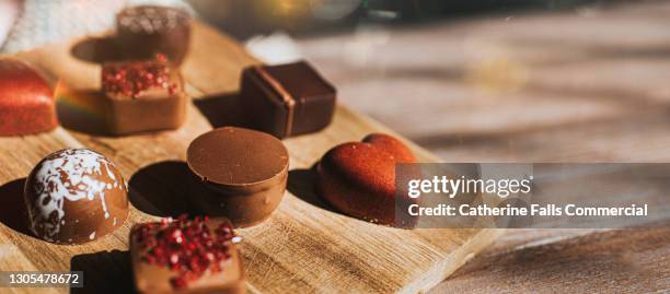 close-up of luxurious chocolates - luxury chocolate box stock pictures, royalty-free photos & images