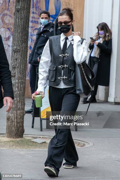 Model Bella Hadid is seen leaving the Starbucks Avenue de Wagram on March 05, 2021 in Paris, France.