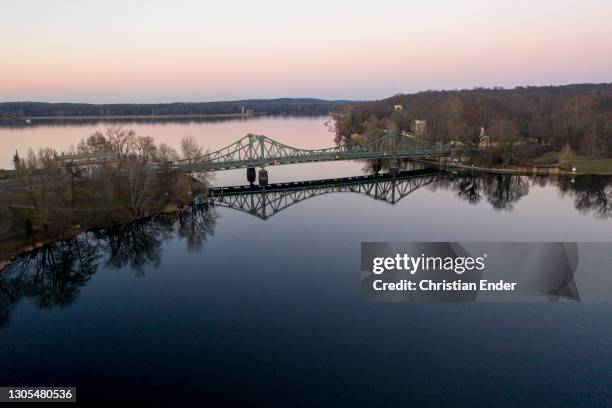 In this aerial view from a drone the Glienicke Bridge spanning the Havel river at sunset during the novel coronavirus pandemic on March 1, 2021 in...