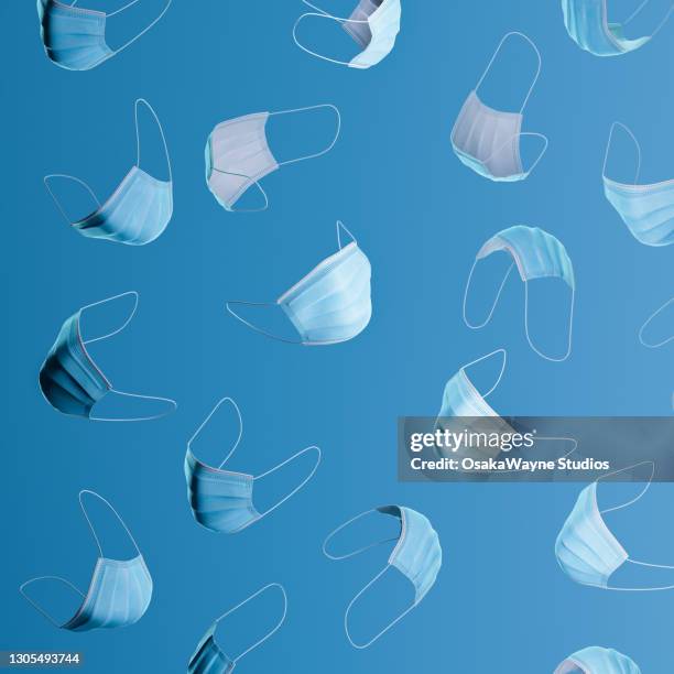 pattern of various views on protective face mask on blue background - face mask coronavirus photos et images de collection