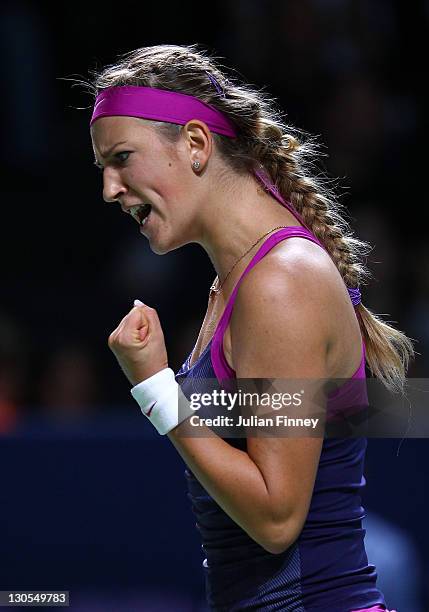 Victoria Azarenka of Belarus celebrates winning a game in her match against Samantha Stosur of Australia during day two of the season ending TEB BNP...