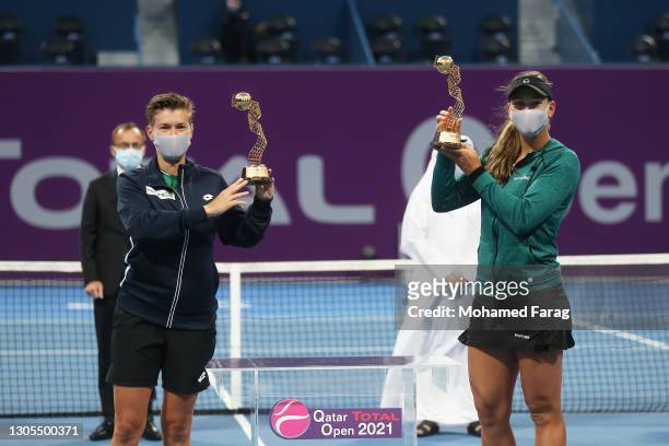 Demi Schuurs of The Netherlands and Nicole Melichar of The United States pose with their trophies after winning their doubles Final match against...