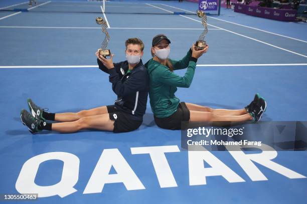 Demi Schuurs of The Netherlands and Nicole Melichar of The United States pose with their trophies after winning their doubles Final match against...