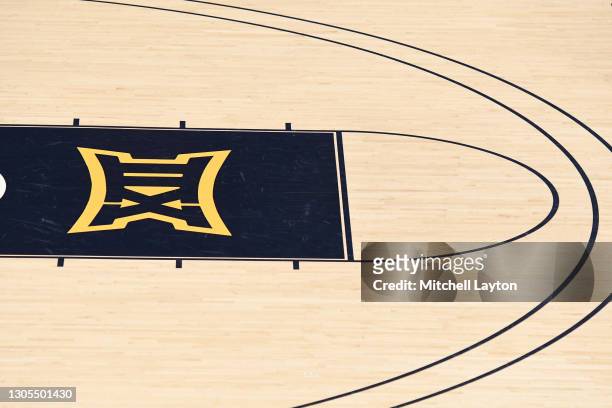 The Big 12 logo on the floor before a college basketball game between the West Virginia Mountaineers and the Baylor Bears at WVU Coliseum on March 2,...