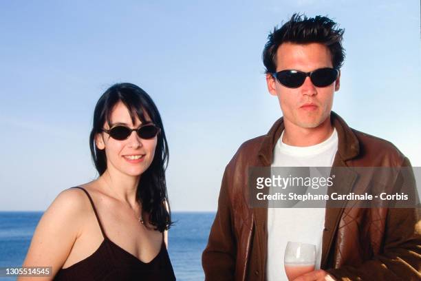 Geraldine Pailhas and Johnny Depp pose for « Don Juan DeMarco » movie during the 48th Annual Cannes Film Festival on May 24, 1995 in Cannes, France.