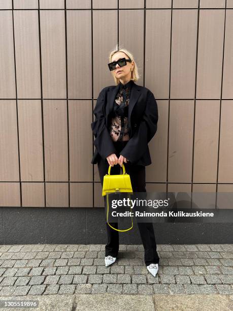 Justyna Czerniak cherishing Paris Fashion Designers for Paris fashion week by wearing Acne Studios black semitransparent shirt, black blazer and...