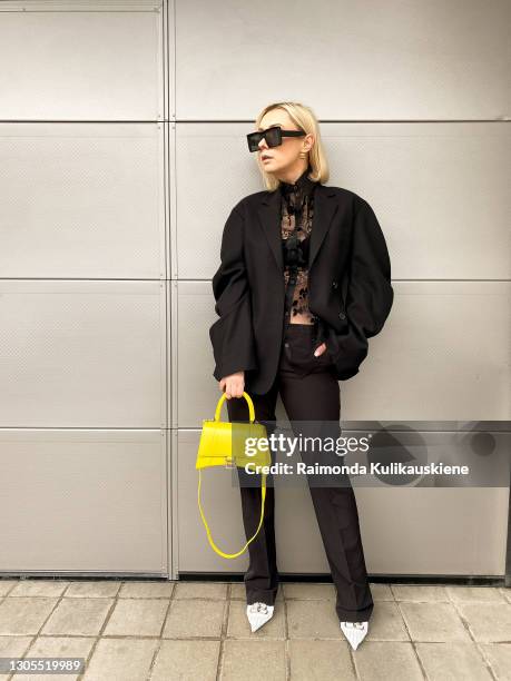 Justyna Czerniak cherishing Paris Fashion Designers for Paris fashion week by wearing Acne Studios black semitransparent shirt, black blazer and...