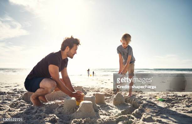 having kids lets you discover the world all over again - sandcastle stock pictures, royalty-free photos & images