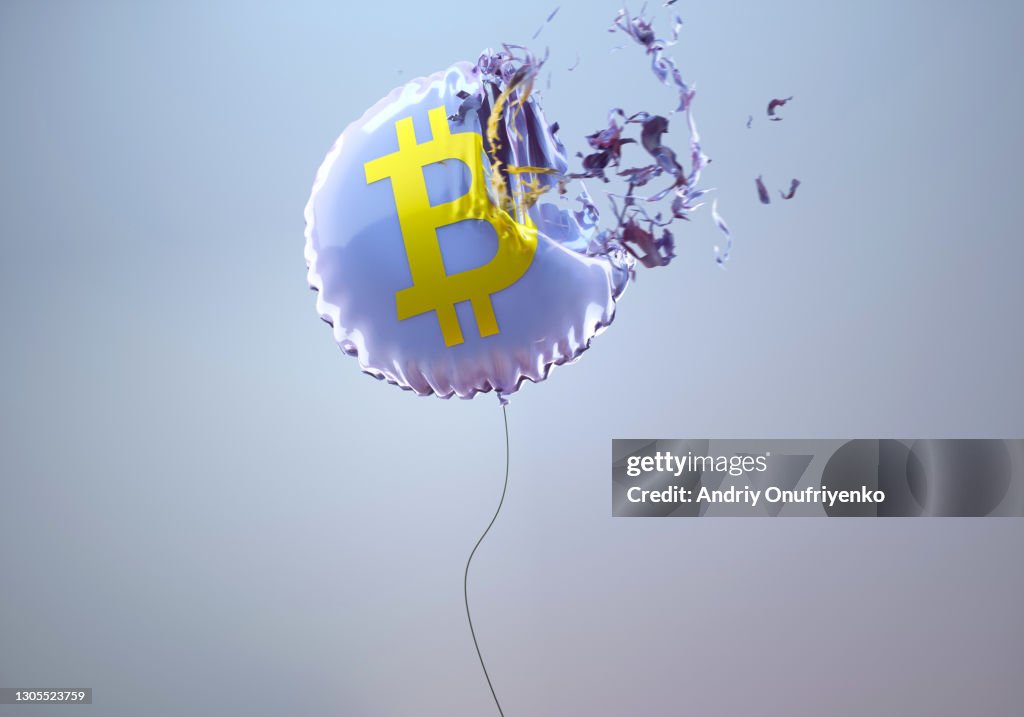 Bitcoin sign balloon bursting