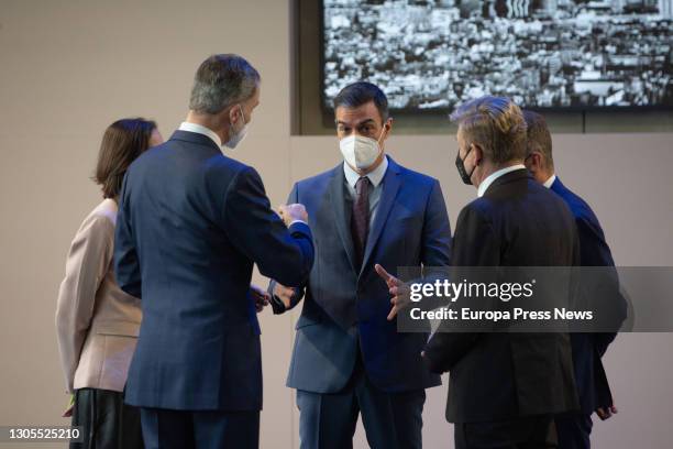 King Felipe VI and Prime Minister Pedro Sanchez keep a conversation in a tour SEAT's facilities in Martorell on the occasion of the 70th anniversary...