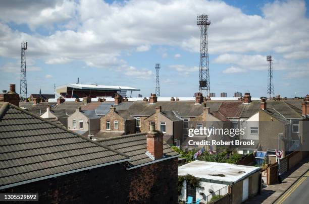 rear of row of houses next to grimsby town football club. photographed in cleethorpes (between cleethorpes and grimsby), lincolnshire. - sport community center stock pictures, royalty-free photos & images