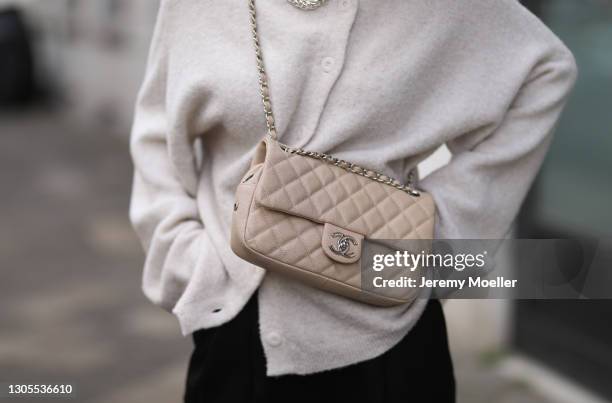 Kathrin Bommann wearing Vival cardigan, LouLou Studio pants, beige Chanel bag on February 27, 2021 in Dusseldorf, Germany.