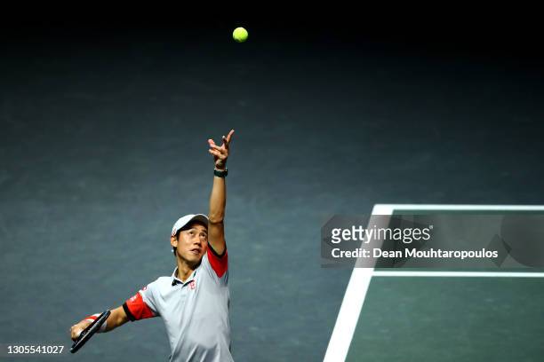 Kei Nishikori of Japan serves in his match against Borna Coric of Croatia during Day 5 of the 48th ABN AMRO World Tennis Tournament at Ahoy on March...
