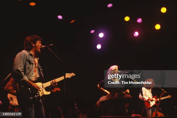 Rodney Crowell, Emmylou Harris, and Albert Lee of the Hot Band perform at The Fillmore on April 3, 1995 in San Francisco, California.