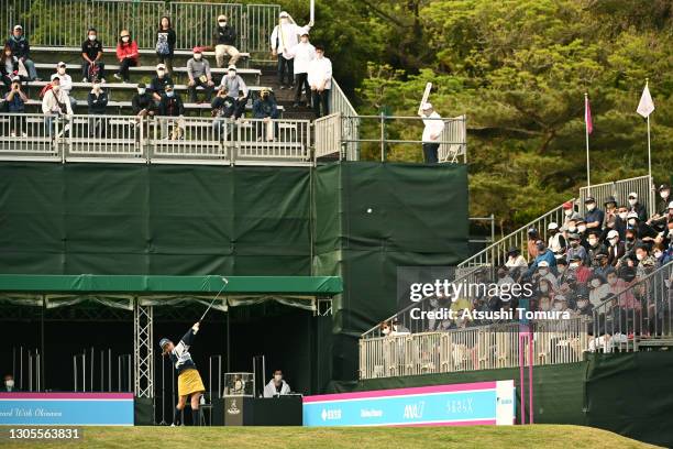 Erina Hara of Japan hits her tee shot on the 1st hole while fans watch in the stand during the third round of the Daikin Orchid Ladies at the Ryukyu...