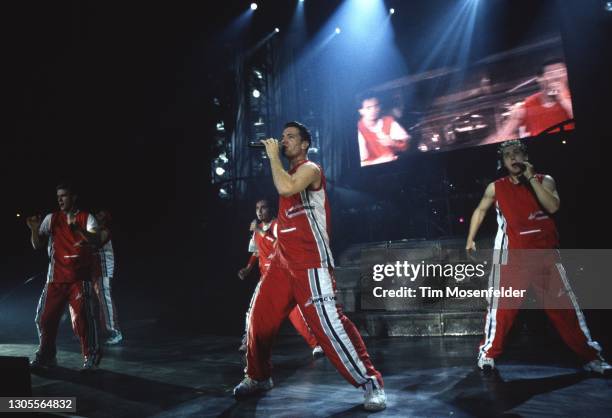 Justin Timberlake, Joey Fatone, Chris Kirkpatrick, JC Chasez, and Lance Bass of NSYNC perform at Shoreline Amphitheatre on August 21, 1999 in...