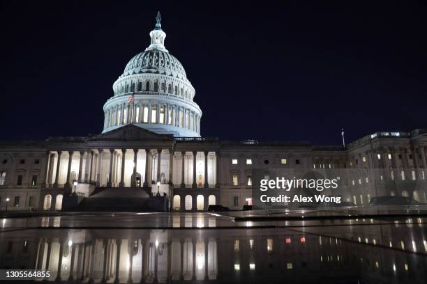 The U.S. Capitol is seen in the evening hours on March 5, 2021 in Washington, DC. The Senate continues to debate the latest COVID-19 relief bill.