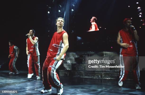 Justin Timberlake, Chris Kirkpatrick, Lance Bass, and Joey Fatone of NSYNC perform at Shoreline Amphitheatre on August 21, 1999 in Mountain View,...