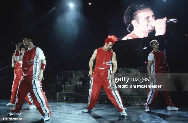 Chasez, Joey Fatone, and Justin Timberlake of NSYNC perform at Shoreline Amphitheatre on August 21, 1999 in Mountain View, California.