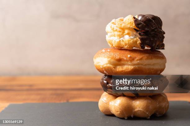 a bunch of doughnuts - ドーナツ ストックフォトと画像