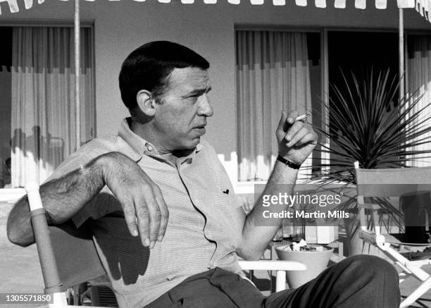 American jazz drummer and bandleader Buddy Rich sits and smokes his cigarette circa 1968 in Los Angeles, California.