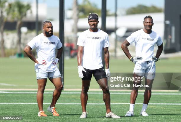 Wide receivers Amari Rodgers, Jhamon Ausbon and Brandon Smith attend the House of Athlete Scouting Combine at the Inter Miami CF Stadium practice...