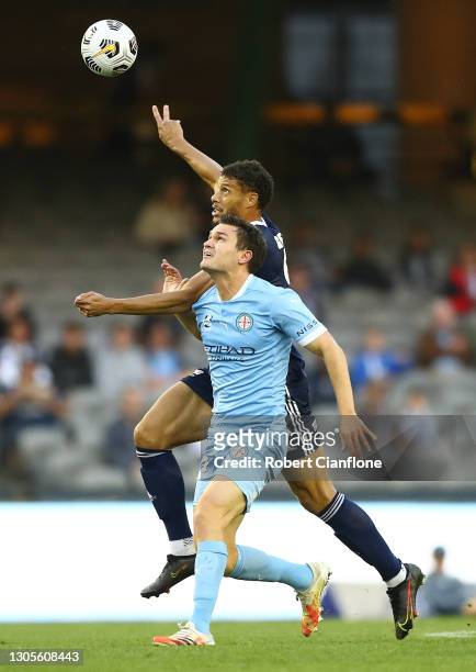 Curtis Good of Melbourne City is challenged by Rudy Gestede of the Victory during the A-League match between the Melbourne Victory and Melbourne City...