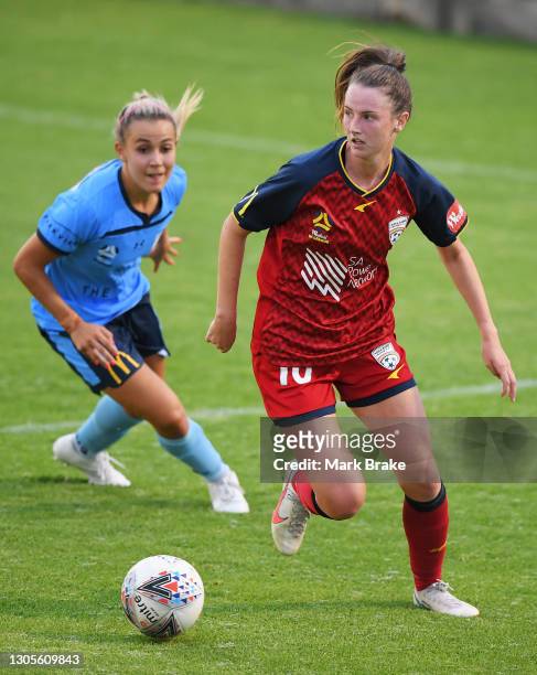 Chelsie Dawber of Adelaide United competes with Angelique Hristodoulou of Sydney FC during the round 11 W-League match between Adelaide United and...