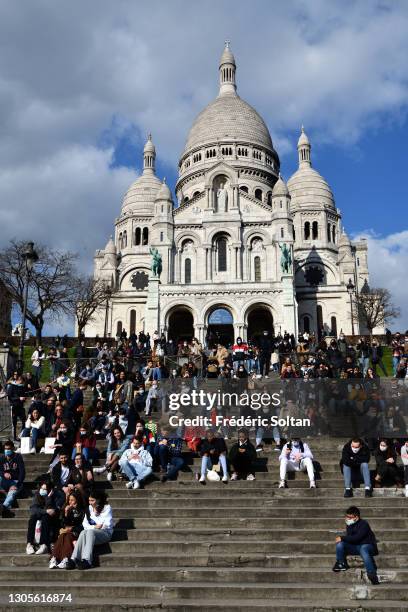 The Basilica of the Sacred Heart of Paris, located at the summit of the butte Montmartre, on February 26, 2021 in Paris, France.